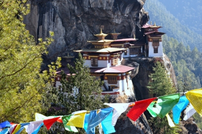 Guru Rinpoche's Taktsang Monastery with prayer flags, Bhutan (Wonderlane)  [flickr.com]  CC BY 
License Information available under 'Proof of Image Sources'